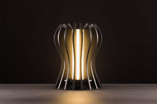 Casper table lamp in natural oak, handcrafted Italian design, sculptural minimal design, refined elegance, warm light, studio black background.