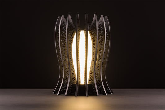 Lady Noir lamp in dark stained walnut, Italian handcrafted luxury design, warm 2700K LED, photographed on black studio background.