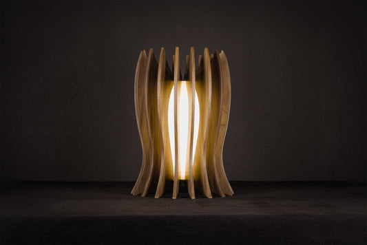 Handcrafted LED table lamp made from solid Canaletto walnut with a gold lacquered stainless steel frame, pure linen wrapped plexiglass diffuser and warm 2700K LED lighting, artisan made in Italy.
