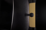Handmade Tulip coat stand crafted in Italy with premium textured finishes in black and refined gold details.