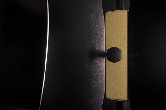 Handmade Tulip coat stand crafted in Italy with premium textured finishes in black and refined gold details.