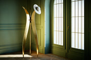 Sculptural Tulip coat hanger handmade in Italy with sophisticated black textured surfaces and refined gold finishes.