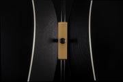 Luxury Tulip sculptural coat rack handcrafted in Italy with textured black finish and elegant gold accents.