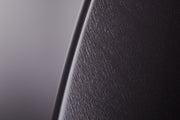 Signature Tulip coat stand detail crafted by Italian artisans with textured black finish and luxurious metallic gold detailing.