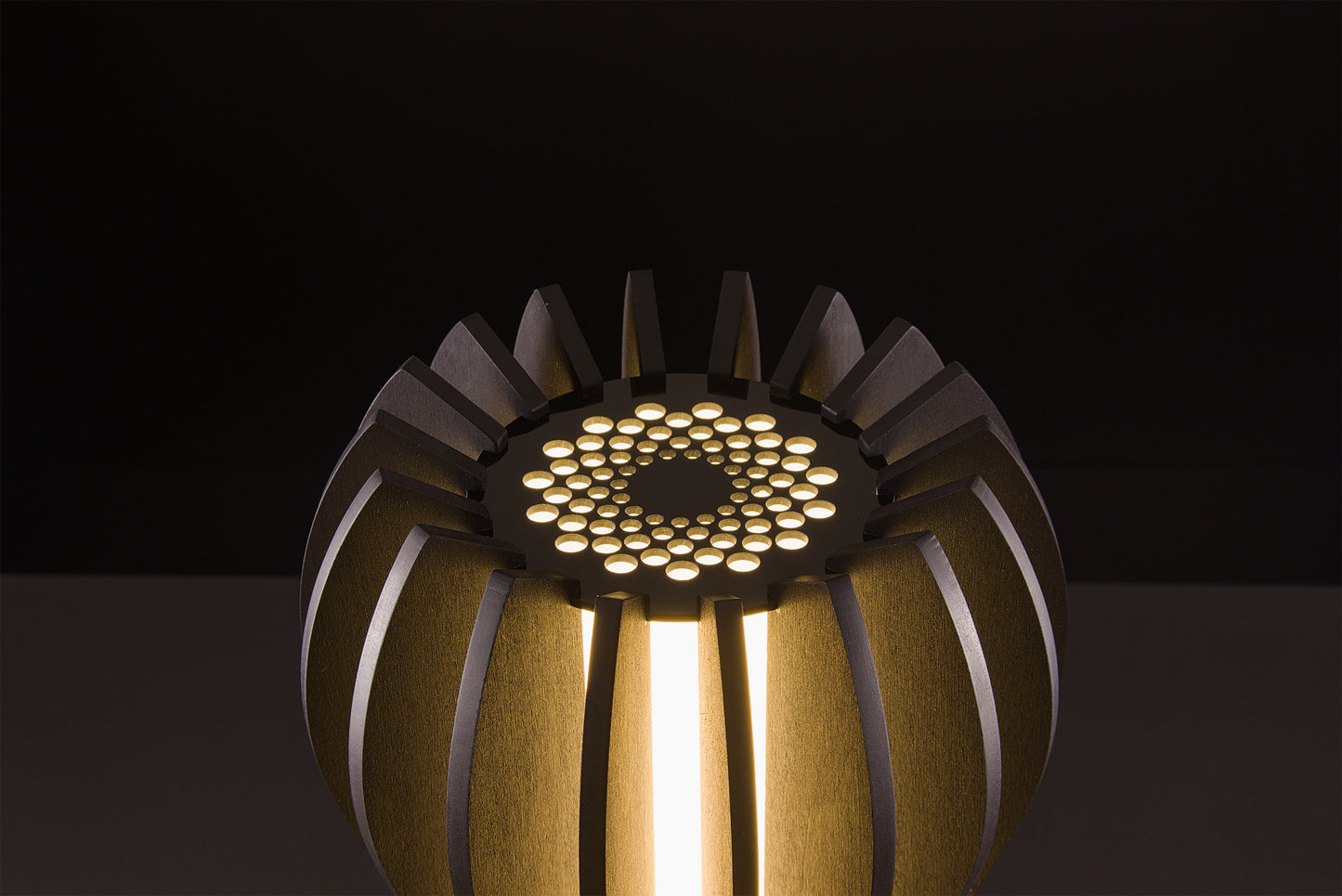 Luxury Medusa lamp in natural oak veneer, Italian handmade craftsmanship, soft warm LED, photographed in studio on black.