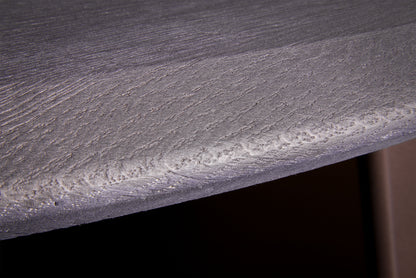 Close-up of handmade Edones round coffee table in ultra-matte black oak, showing wood grain texture and brushed details, by Vera Forma.