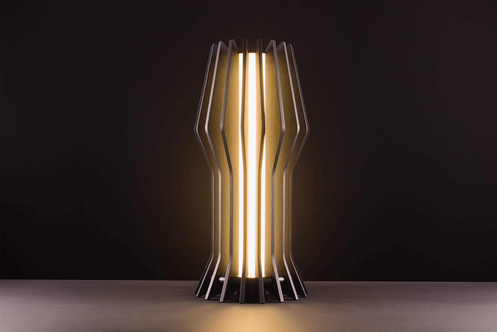 Futura table lamp in dark walnut, handcrafted Italian design, sculptural minimal style, high gloss details, warm light, studio black background.