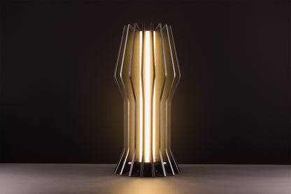 Futura table lamp in dark walnut, handcrafted Italian design, sculptural minimal style, high gloss details, warm light, studio black background.