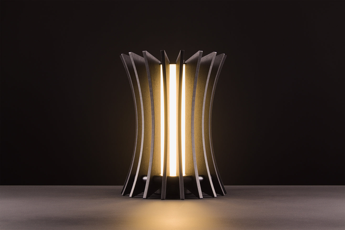 Gothica table lamp in natural oak veneer, handcrafted Italian design, warm light, luxury material product on black studio background.