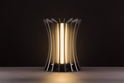 Gothica table lamp in natural oak veneer, handcrafted Italian design, warm light, luxury material product on black studio background.