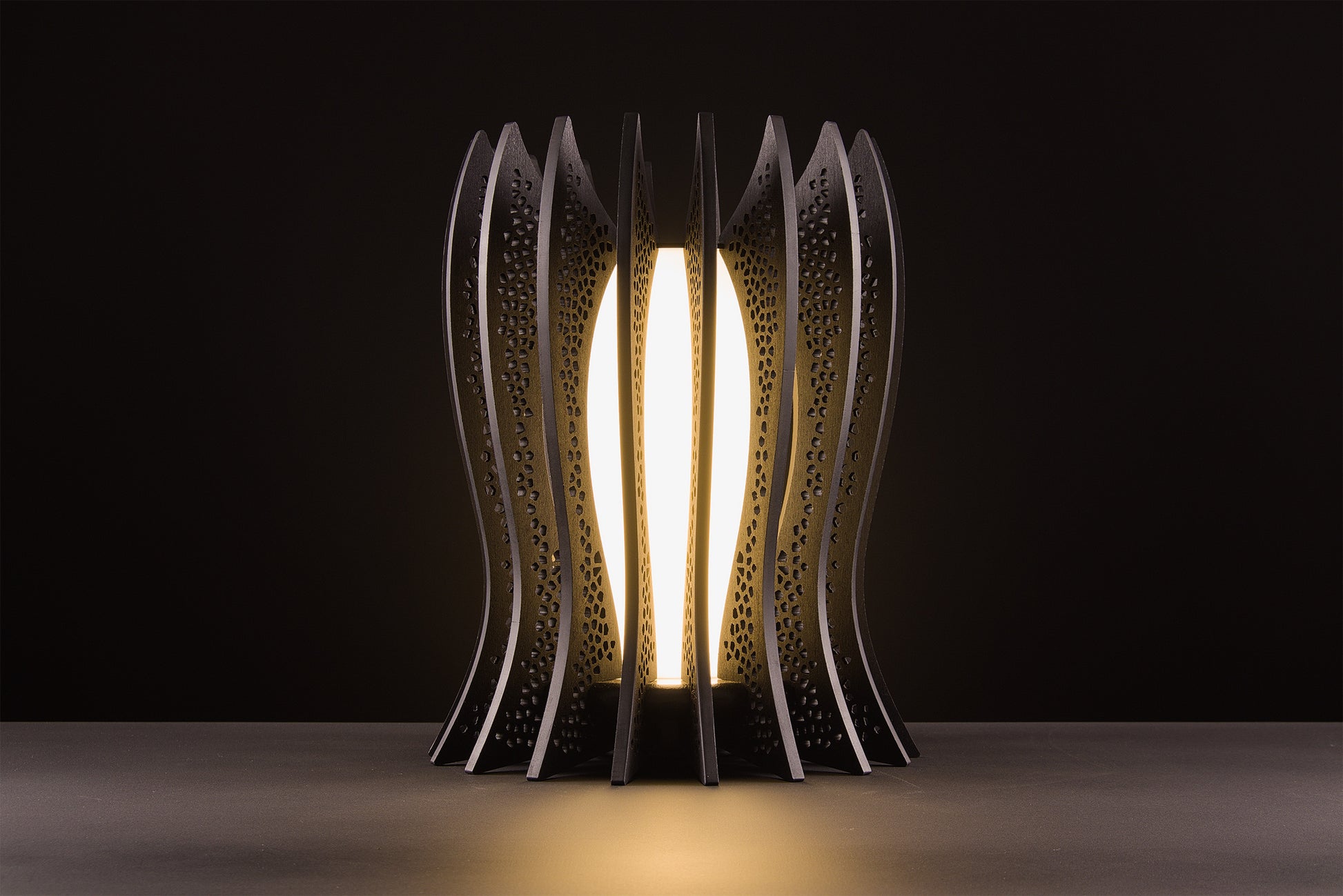 Lady Noir lamp in dark stained walnut, Italian handcrafted luxury design, warm 2700K LED, photographed on black studio background.