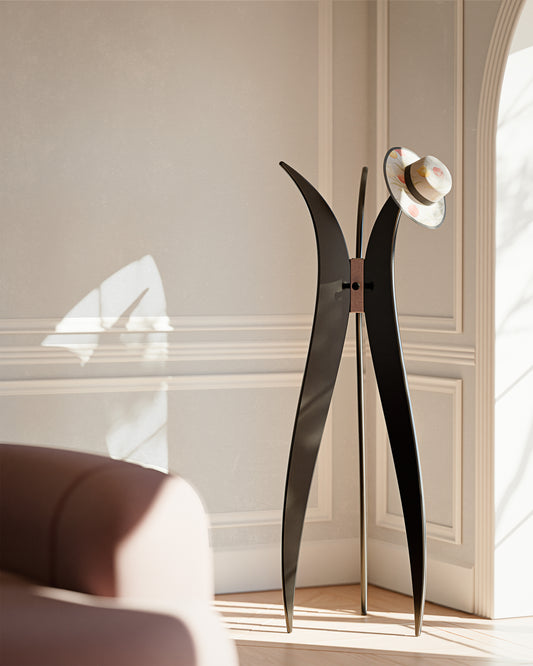 Luxury coat hanger in satin black and metallic embossed bronze finishes. Haussmannian-style design, in classic living interiors.