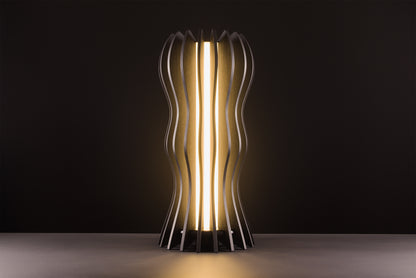 Medusa lamp in dark stained walnut, handcrafted Italian design, warm light, luxury studio black background.