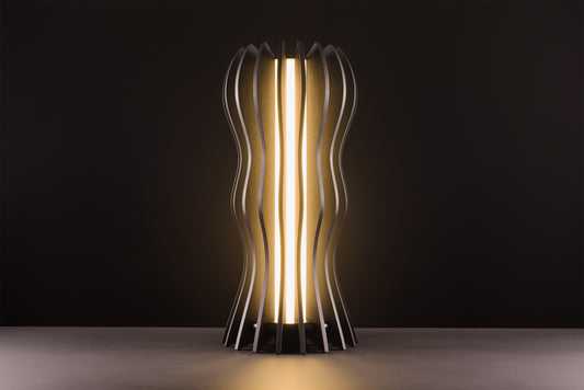 Medusa lamp in dark stained walnut, handcrafted Italian design, warm light, luxury studio black background.